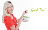 Good food against side view of a young blonde woman eating vegetable salad