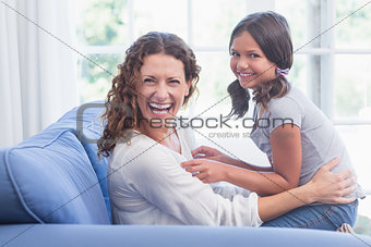 Happy mother and daughter having fun