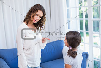 Upset mother looking at her daughter