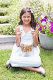 Happy girl collecting easter eggs