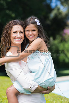 Happy mother and daughter hugging