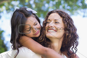 Happy mother and daughter embracing