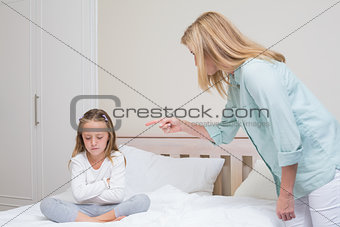 Upset mother scolding her daughter