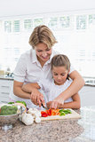 Mother and daughter preparing vegetables
