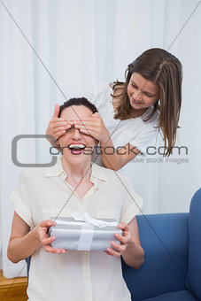 Daughter giving her mother a present