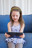 Little girl using tablet pc