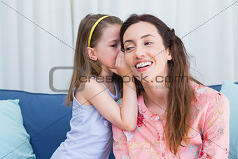 Mother and daughter sharing secrets