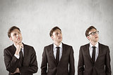 Composite image of nerdy businessman thinking