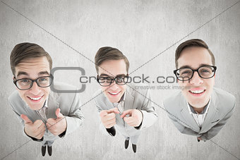 Composite image of nerdy businessman showing thumbs up