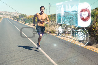 Composite image of athletic man jogging on open road with monitor around chest