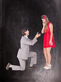 Composite image of hipster on bended knee doing a marriage proposal to his girlfriend