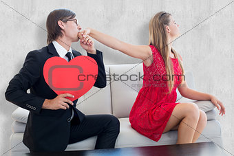 Composite image of cute geeky couple with red heart shape
