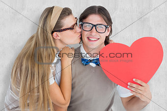 Composite image of smiling geeky hipster and his girlfriend