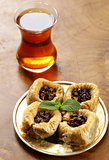 Turkish arabic dessert - baklava with honey and walnut, pistachios nuts