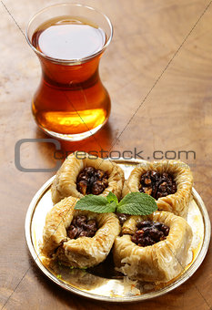 Turkish arabic dessert - baklava with honey and walnut, pistachios nuts