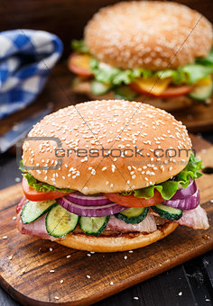 Bacon burger with vegetables and cutlet