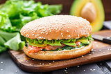 Burger with salmon and avocado