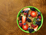 homemade granola muesli with berries (strawberries, raspberries, blueberries) for breakfast
