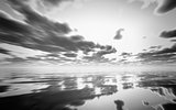 Abstract black and white 3D sunset over the ocean
