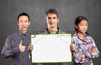 Asian team and male with write board in his hands
