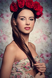 brunette woman with roses on head 