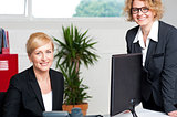 Executive women posing at office