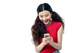 Pretty chinese girl reading funny message