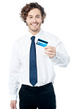 Happy man displaying his cash card