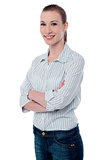Confident businesswoman with folded arms