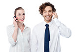 Business people communicating thru mobile phone