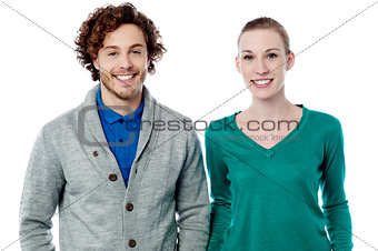 Smiling fashion couple posing together