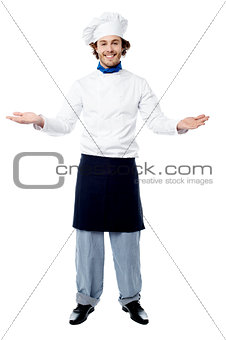 Male chef in uniform welcoming guests