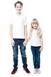 Happy brother and sister, studio shot