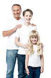 Happy father with children standing in row