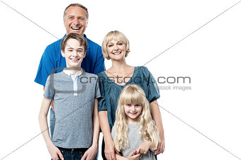 Cheerful family of four studio portrait