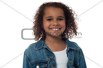 Cheerful little girl posing