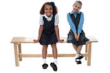 Little girls sitting on the bench