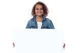 Little girl behind blank whiteboard
