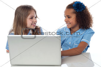 Little girls learning in laptop