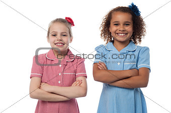 Little girls posing with arms crossed