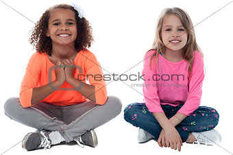 Little girls sitting on floor