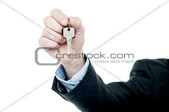 Male hand giving your key, isolated on white