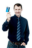 Business executive holding a credit card