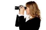 Attractive woman viewing through binocular