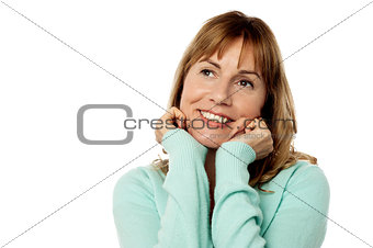 Happy female with hands on chin