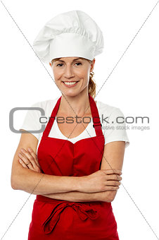 Female chef posing with folded arms