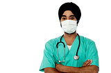 Young male doctor with face mask