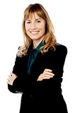Smiling business woman with folded arms