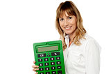Smiling woman showing big calculator