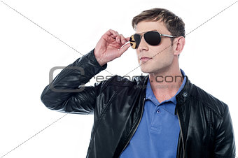Handsome man in leather jacket looking away